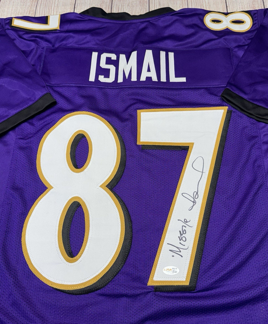 Qadry Ismail signature detail on Baltimore Ravens purple jersey