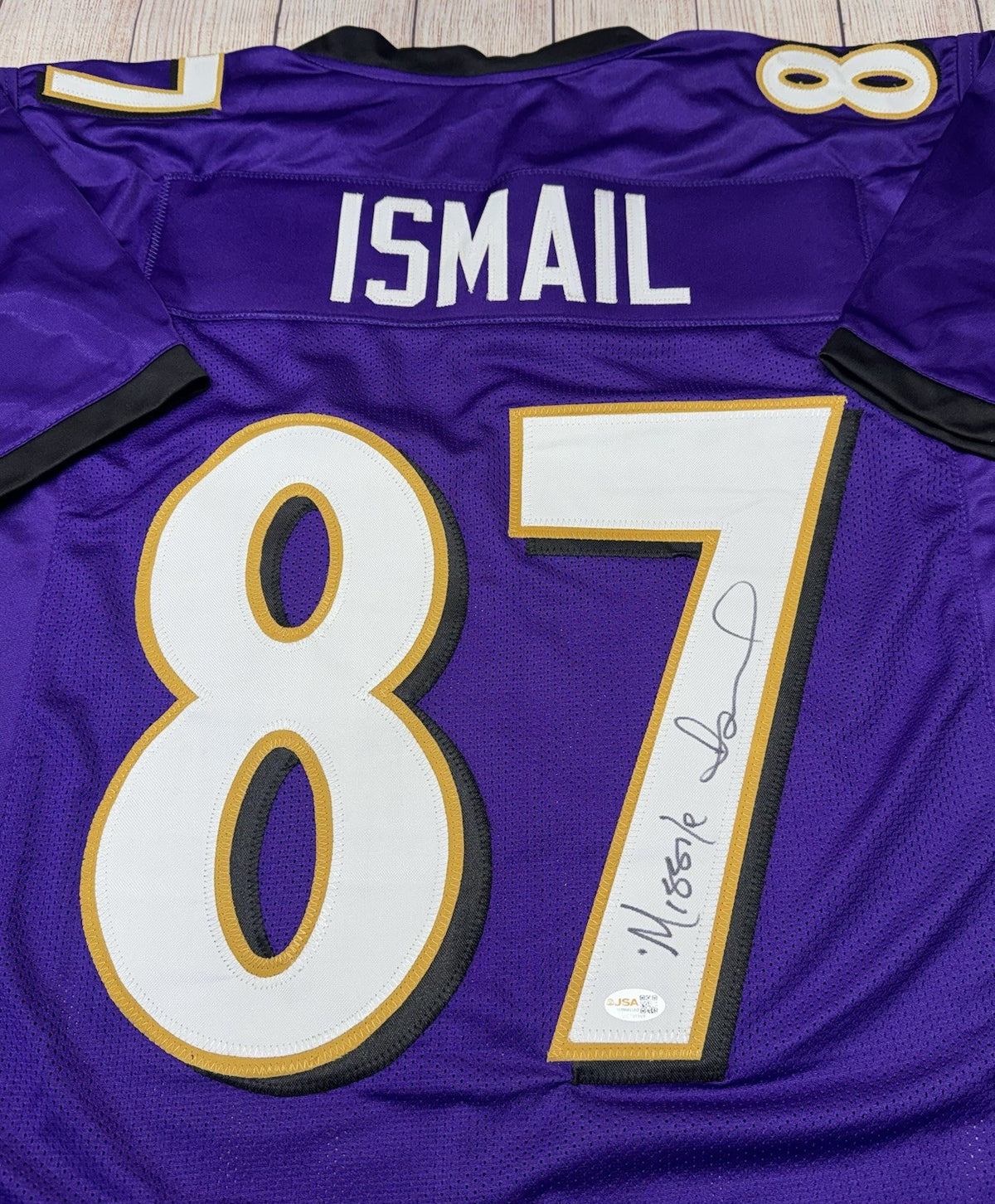 Qadry Ismail signature detail on Baltimore Ravens purple jersey